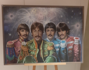 Un poster dei Beatles esposto da Gigi Lovato al Bar Minerva