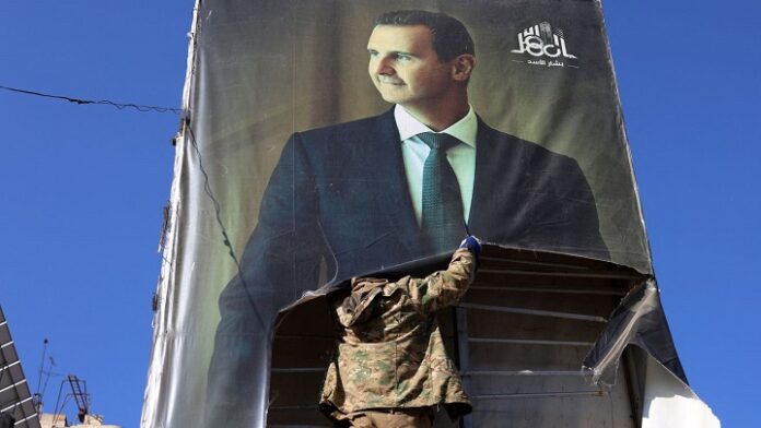 I ribelli rimuovono immagini di Assad